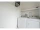 Laundry room with washer and dryer hookups and shelving at 524 S Allred Dr, Tempe, AZ 85288