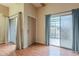 Living room with hardwood floors, sliding doors to patio, and a neutral color palette at 524 S Allred Dr, Tempe, AZ 85288
