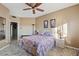 Bedroom with queen bed, ceiling fan, and access to hallway at 5345 E Mclellan Rd # 27, Mesa, AZ 85205