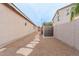 Landscaped backyard with stone pathway, shed, and block wall at 5502 S Pico St, Gilbert, AZ 85298