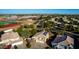 Aerial view of house with solar panels, large backyard, and neighborhood in background at 6443 N 77Th Dr, Glendale, AZ 85303