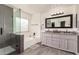 Bathroom with a walk-in shower and double vanity at 6443 N 77Th Dr, Glendale, AZ 85303