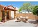 Charming patio with fire pit and comfortable seating for outdoor relaxation at 830 E Fairway Dr, Litchfield Park, AZ 85340