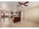 Kitchen with island, tile floor and stainless steel appliances at 8534 N 106Th Ln, Peoria, AZ 85345