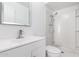 Clean bathroom with white vanity, shower, and a large mirror at 8840 W Desert Cove Ave, Peoria, AZ 85345