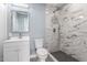 Updated bathroom with marble shower and modern vanity at 8840 W Desert Cove Ave, Peoria, AZ 85345