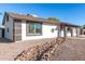 Single story home with rock landscaping and walkway at 8840 W Desert Cove Ave, Peoria, AZ 85345