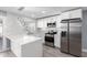 Modern kitchen with white cabinets and stainless steel appliances at 8840 W Desert Cove Ave, Peoria, AZ 85345