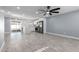 Open concept living room with kitchen and grey tile floors at 8840 W Desert Cove Ave, Peoria, AZ 85345