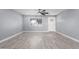 Living room with grey walls, tile floors and ceiling fan at 8840 W Desert Cove Ave, Peoria, AZ 85345