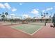 Two community pickleball courts with benches and surrounding fence at 9302 E Broadway Rd # 150, Mesa, AZ 85208