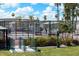 Community tennis court with benches and surrounding fence at 9302 E Broadway Rd # 150, Mesa, AZ 85208