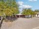 House with a red front door and gravel driveway at 1022 W Calle Tuberia --, Casa Grande, AZ 85194