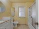 Bathroom with walk-in shower and white vanity at 10447 W Pleasant Valley Rd, Sun City, AZ 85351