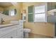 Bathroom with vanity, toilet and shower/tub combo at 10447 W Pleasant Valley Rd, Sun City, AZ 85351