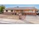 Brick ranch house with a covered porch and a well-maintained yard at 11428 N 57Th Ln, Glendale, AZ 85304