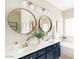 Elegant bathroom with double vanity and large mirrors at 12543 W Estero Ln, Litchfield Park, AZ 85340