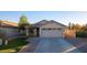 Single-story home with attached garage and front yard at 13267 W Port Au Prince Ln, Surprise, AZ 85379