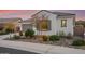 One-car garage, desert landscaping, and charming architectural details at 16573 W Valencia Dr, Goodyear, AZ 85338