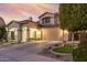 Two-story house with landscaped yard, driveway, and two-car garage at 16922 W Adams St, Goodyear, AZ 85338