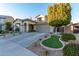 Two-story house with landscaped yard, driveway, and two-car garage at 16922 W Adams St, Goodyear, AZ 85338