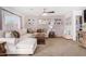 Cozy living room featuring a sectional sofa, coffee table, and ceiling fan at 16922 W Adams St, Goodyear, AZ 85338