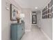 Charming hallway with decorative console table and mirror at 19006 N Sombrero Cir, Sun City, AZ 85373