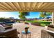 Covered patio overlooks a spacious backyard with a pool and mountain views at 19404 W Minnezona Ave, Litchfield Park, AZ 85340