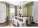 Charming dining room with a modern white table and bench at 19404 W Minnezona Ave, Litchfield Park, AZ 85340