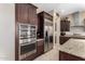 Kitchen features stainless steel appliances and dark wood cabinetry at 2072 S Navajo Ct, Chandler, AZ 85286