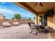 Covered patio with dining area and seating at 2072 S Navajo Ct, Chandler, AZ 85286