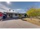 Single story home with carport and well maintained front yard at 2089 E Don Carlos Ave, Tempe, AZ 85281