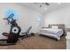 Spacious bedroom with home gym and comfortable bed at 21765 E Arroyo Verde Dr, Queen Creek, AZ 85142