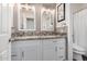 Updated bathroom with double vanity and granite countertops at 245 E Smoke Tree Rd, Gilbert, AZ 85296