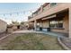 Large backyard with patio, fire pit, and grassy area at 26529 N 167Th Ave, Surprise, AZ 85387