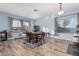 Dining room with light blue walls and hardwood floors at 26529 N 167Th Ave, Surprise, AZ 85387