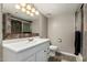 Bathroom with white vanity, shower, and tile flooring at 3061 W Betty Elyse Ln, Phoenix, AZ 85053