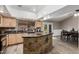 Modern kitchen with granite countertops and large island at 3061 W Betty Elyse Ln, Phoenix, AZ 85053