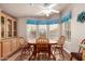 Cozy dining area with a wooden table and chairs, perfect for casual meals at 3301 S Goldfield Rd # 1030, Apache Junction, AZ 85119