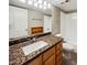 Clean bathroom, granite countertop, wood cabinets and bathtub at 3434 W Danbury Dr # A212, Phoenix, AZ 85053