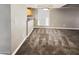 Dining area with carpeted floors and a view of the kitchen at 3434 W Danbury Dr # A212, Phoenix, AZ 85053