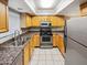 Well-equipped kitchen with granite countertops and modern appliances at 3434 W Danbury Dr # A212, Phoenix, AZ 85053