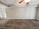 Bright living room with neutral walls and carpet flooring at 3434 W Danbury Dr # A212, Phoenix, AZ 85053