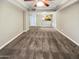 Bright and airy living room with neutral carpeting and high ceilings at 3434 W Danbury Dr # A212, Phoenix, AZ 85053