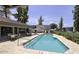 Community pool with surrounding patio furniture at 3434 W Danbury Dr # A212, Phoenix, AZ 85053