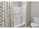 Clean bathroom with a shower/tub combo and decorative shower curtain at 3510 E Hampton Ave # 53, Mesa, AZ 85204