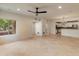 Open living room with tile floors and access to kitchen at 3935 E Rough Rider Rd # 1383, Phoenix, AZ 85050