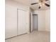 Bright bedroom with double door closet and tile flooring at 42227 W Oakland Dr, Maricopa, AZ 85138