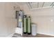 Garage with water heater and water softener system at 4279 E Pony Ln, Gilbert, AZ 85295