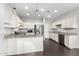 Modern kitchen with white cabinets, granite counters and island at 4279 E Pony Ln, Gilbert, AZ 85295